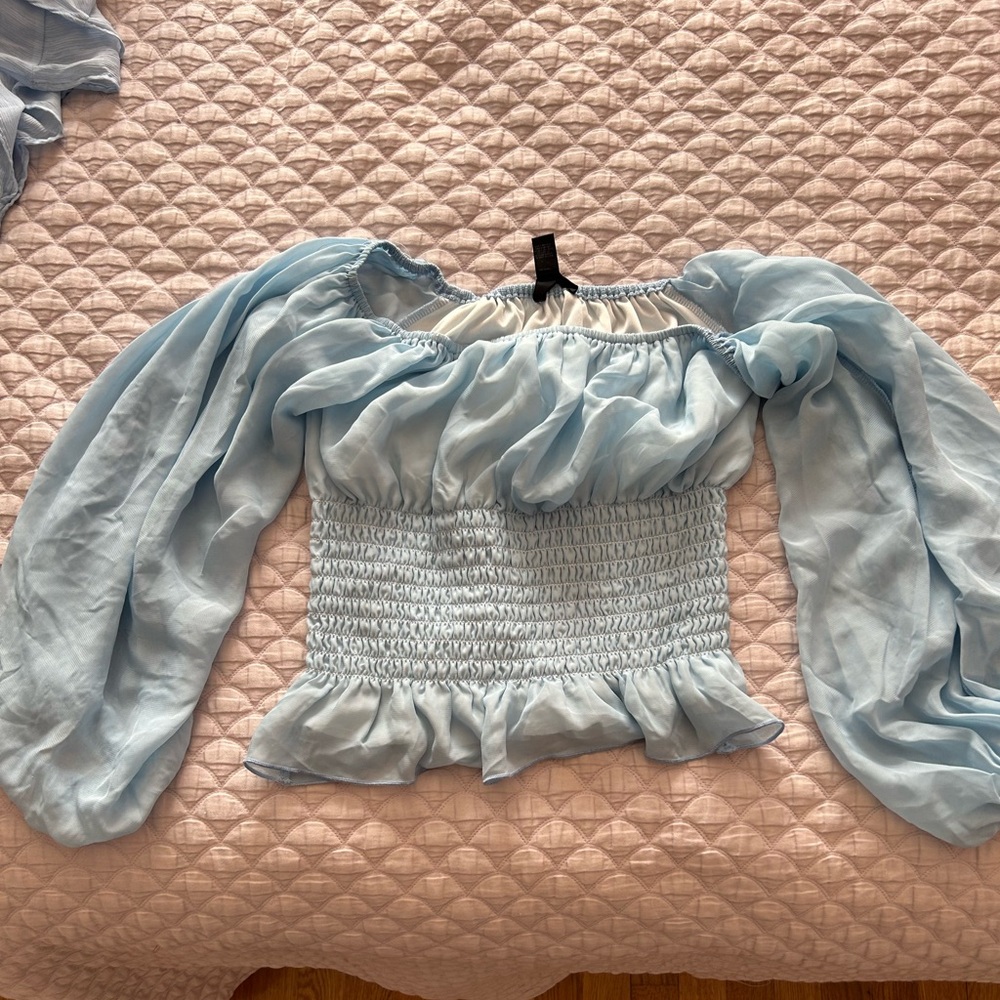 Crop top long sleeve shirt, beautiful light blue color. Barely worn! Size M